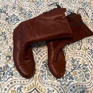 Super soft-leather, back-lace-up boots.